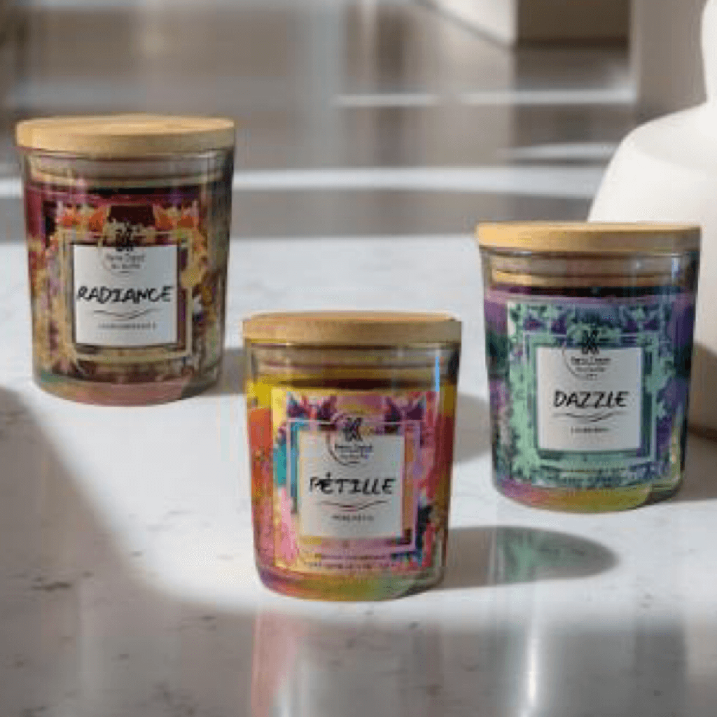 The Sparkle Bundle Tropical Glow Set features three vibrant candles: Radiance, Pétille, and Dazzle in elegant glass jars.