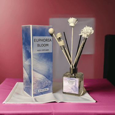 EUPHORIA BLOOM reed diffuser bottle with vibrant floral design and reed sticks